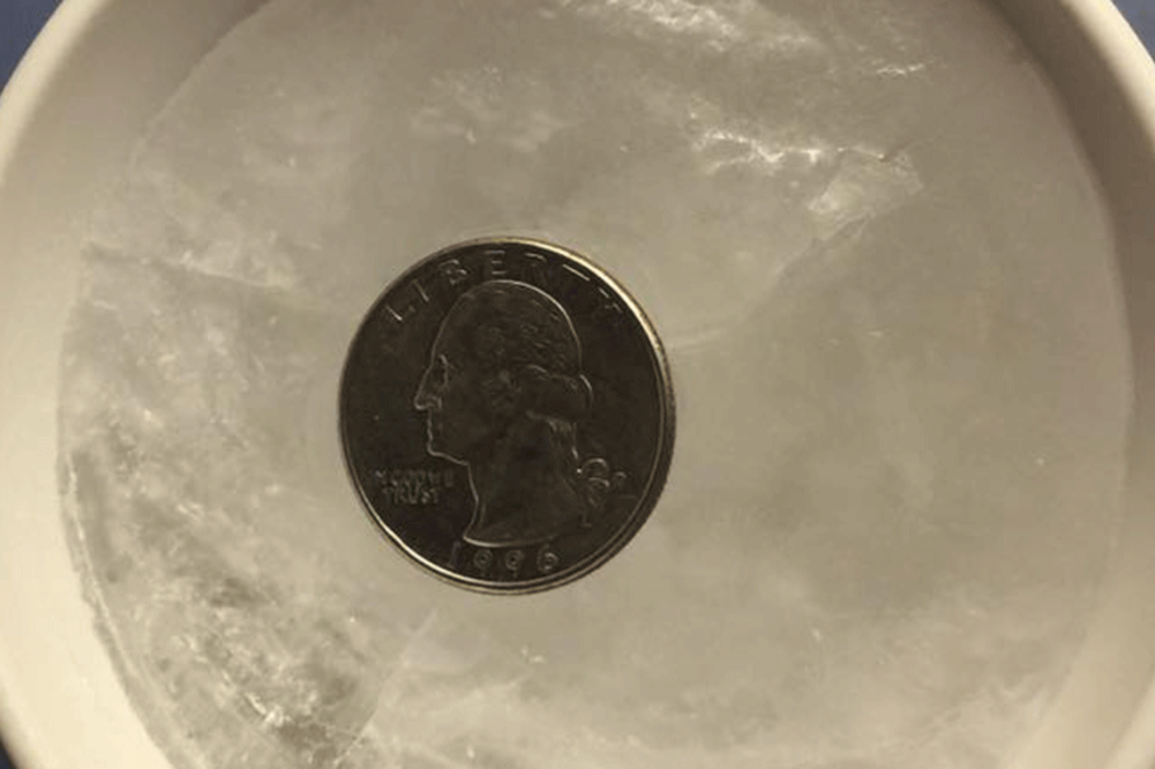 quarter on frozen water