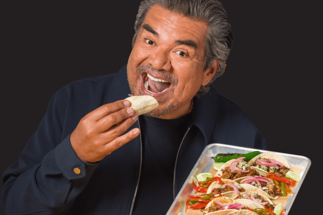 George Lopez eating a taco