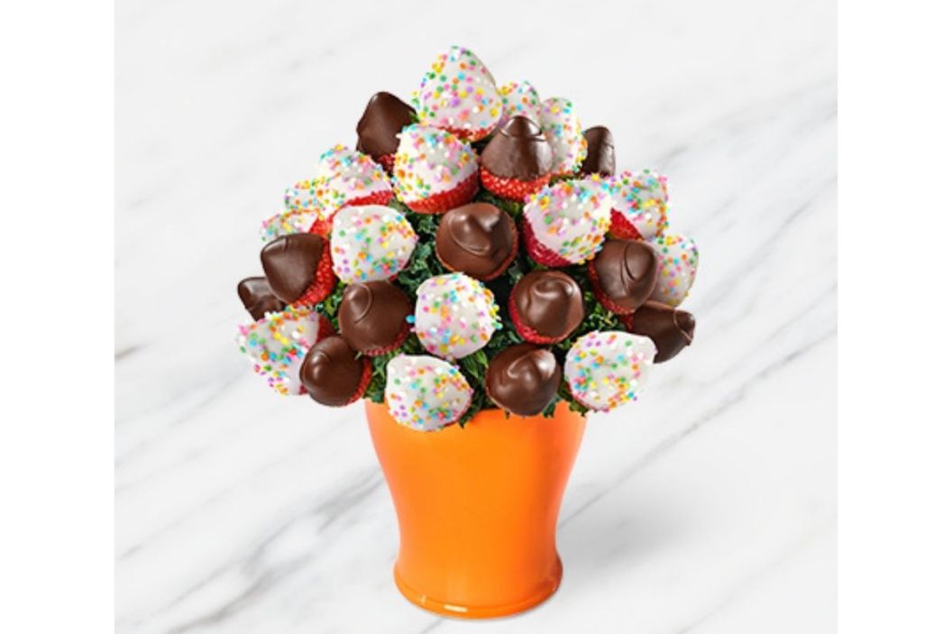 strawberries bouquet (a beautiful white chocolate covered strawberry arrangement in an orange vase)